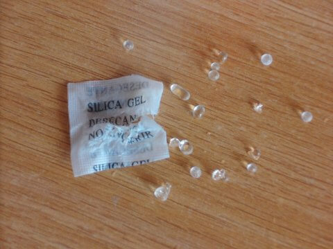 Silica gel might be harder to come by, but it works a lot better than rice does. 