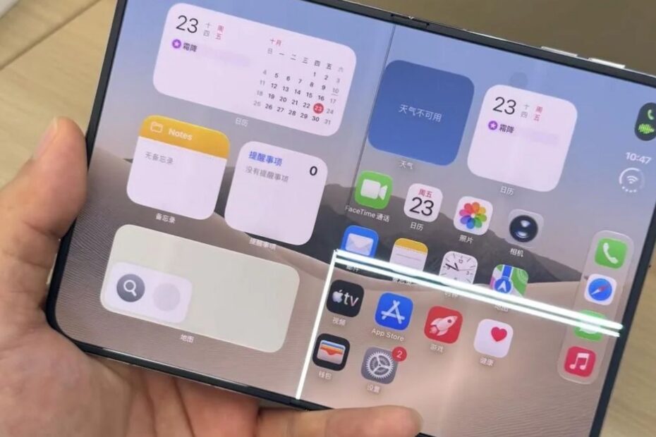 A hand holds an unfolded iPhone Duo. Bright white lines of damaged pixels run across the lower right of its inner screen.