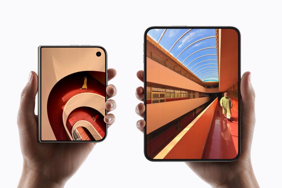 Hands holding two iPhone Duo models, one closed and one open